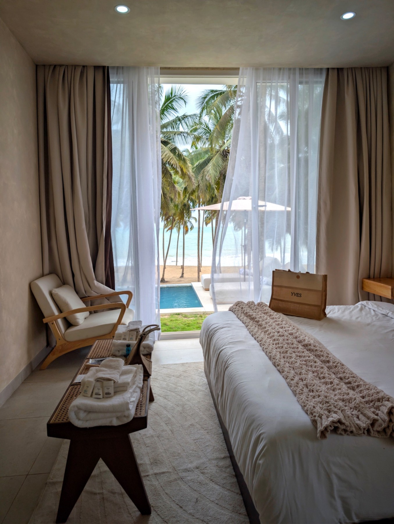 Villa bedroom opening toward the coast at Yves & Saints